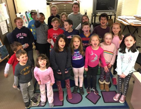 Student journalists working for the expanded and updated Lowell Times pose after their first day in the newsroom at Lowell Elementary School in Watertown, Mass., on April 4, 2019.